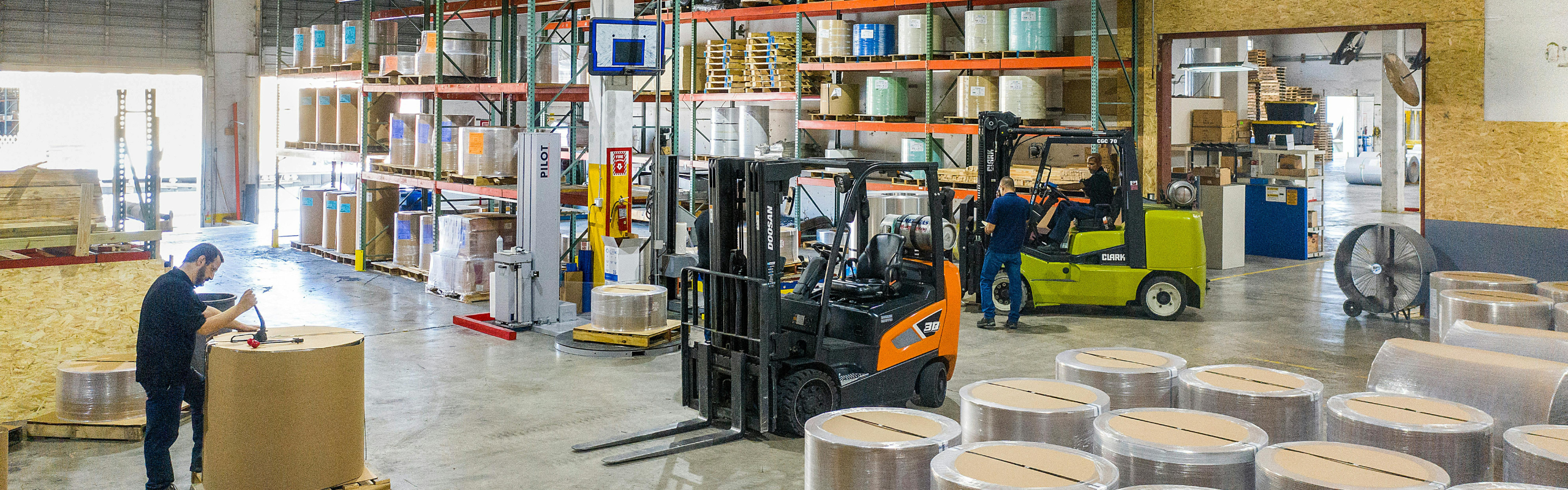Industrial Warehouse with Forklifts in Action