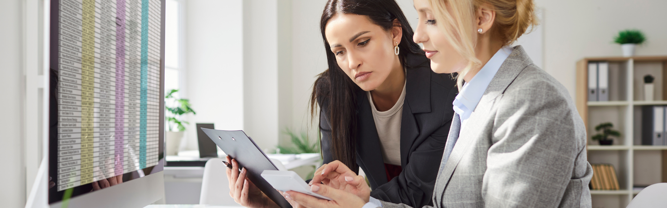 Company employees working and analyzing company accounting on meeting in office.