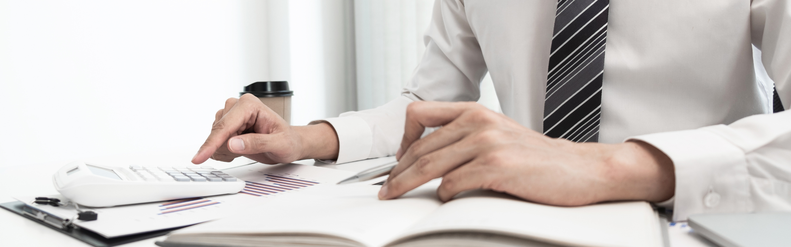 Businessman using calculator for calculate business income