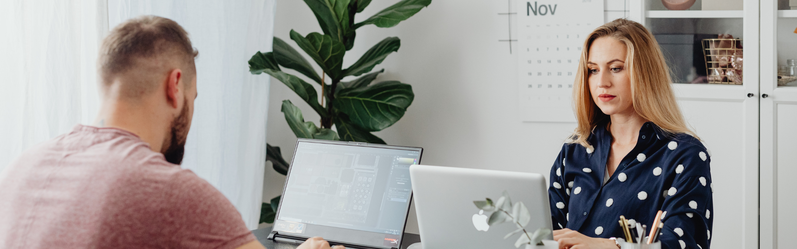 Man and Woman using Laptop Together