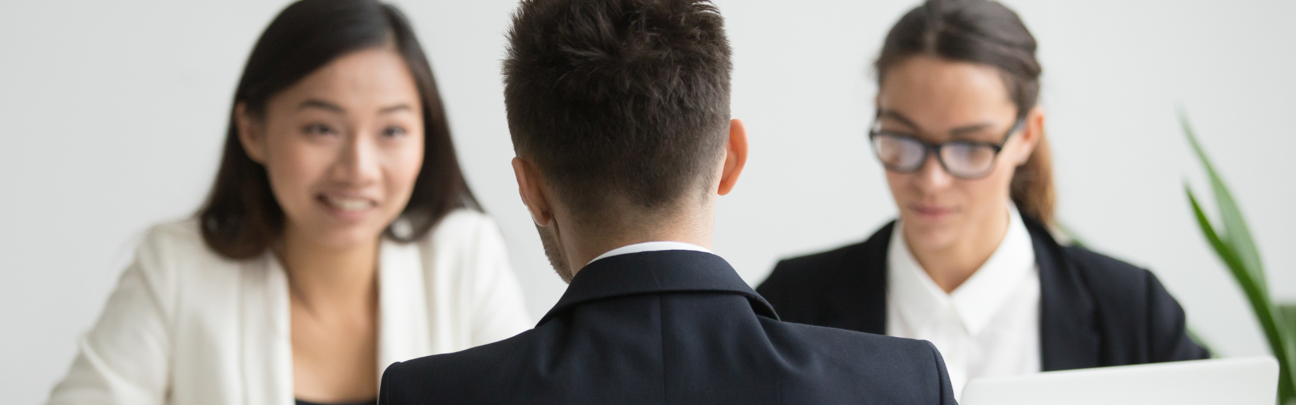 Male candidate interviewed by diverse HR team