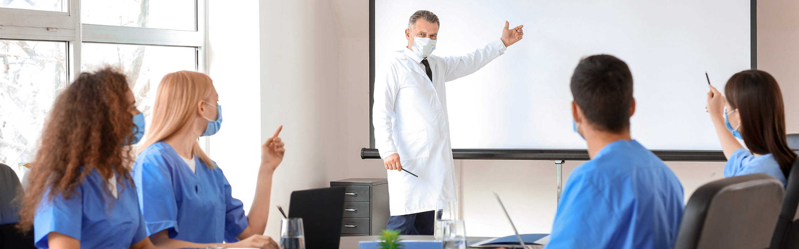 Male Lecturer Teaching Medical Students in University