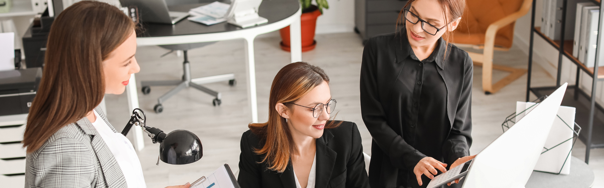 Female Accountants Working in Office