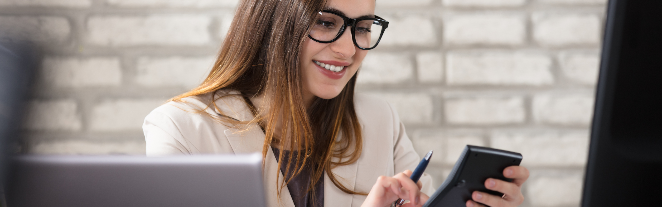 Smiling Accountant Using Calculator
