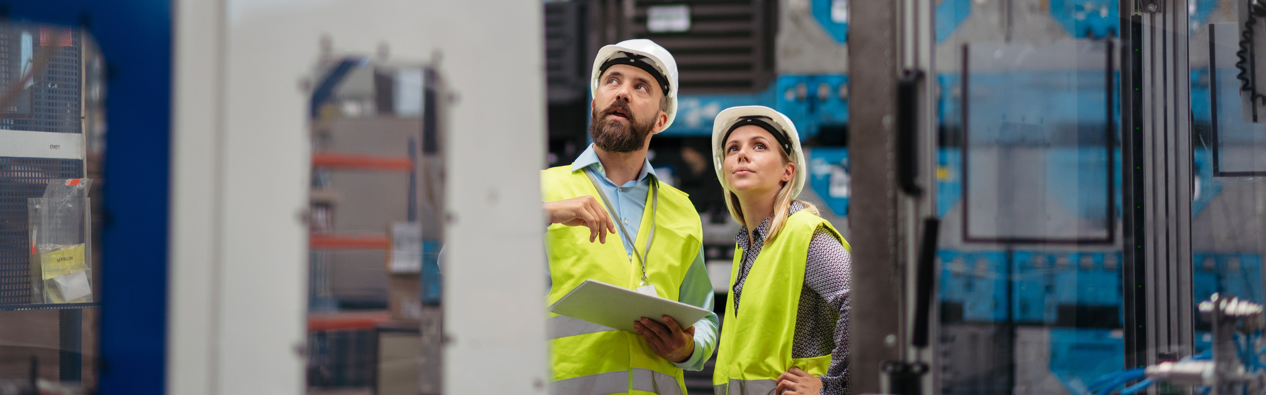 Industrial Team Analyzing Data in High Tech Manufacturing Plant.