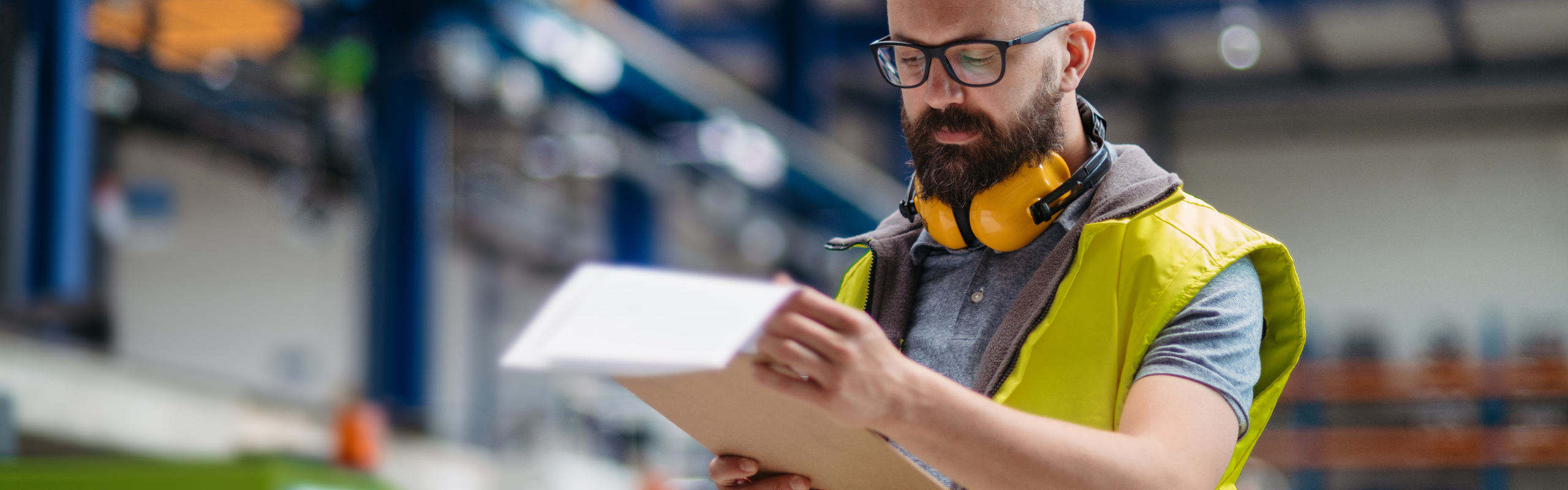Manager Controlling Quality of Products in Factory.
