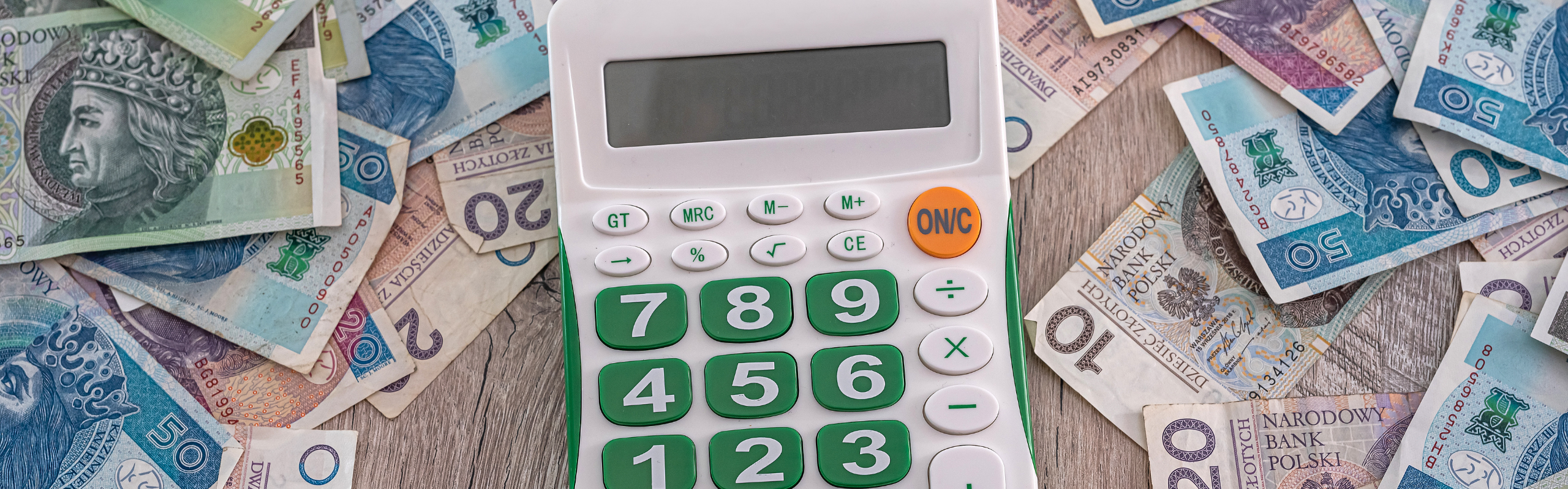 New Clean Smooth Polish Zloty Banknotes Are Scattered and It's Time for a New Calculator.