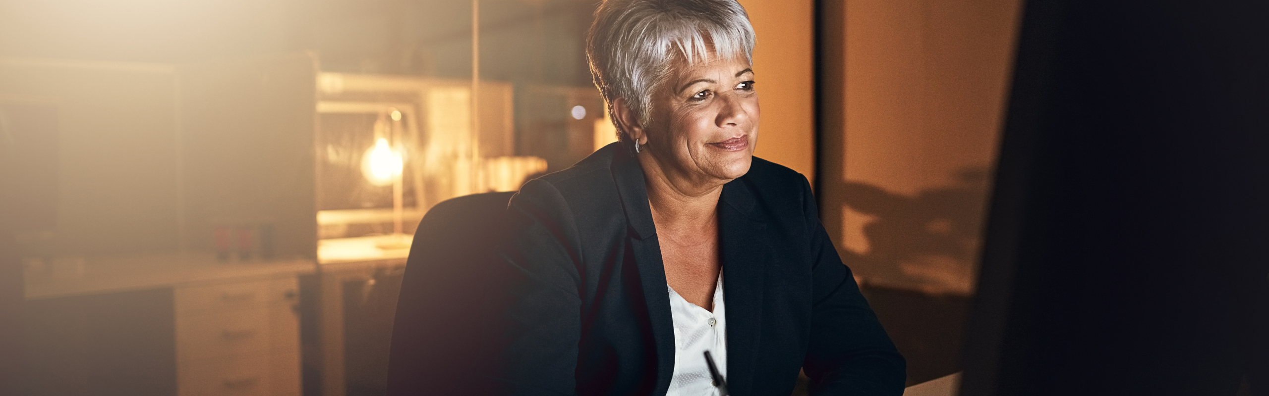 Mature businesswoman working late at night