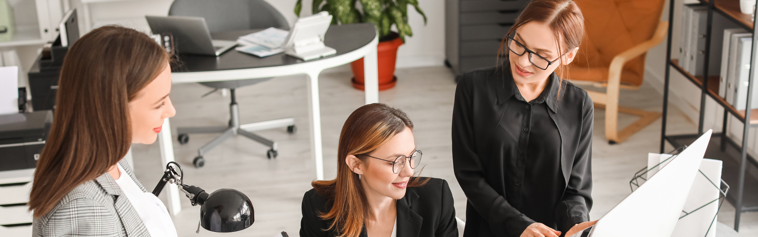 Female Accountants Working in Office