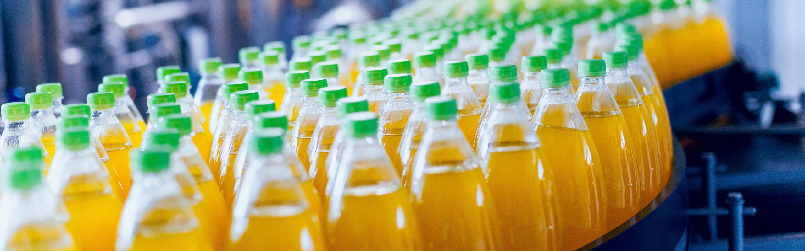 Conveyor with bottles for juice or water. Beverages factory equipments