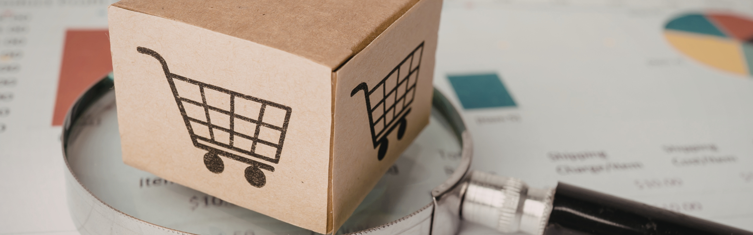Analyzing e commerce growth with a magnifying glass and product box